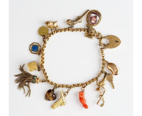 A gold charm bracelet, on an 18ct gold heart shaped padlock clasp, fitted with fourteen gold and other charms, including an e
