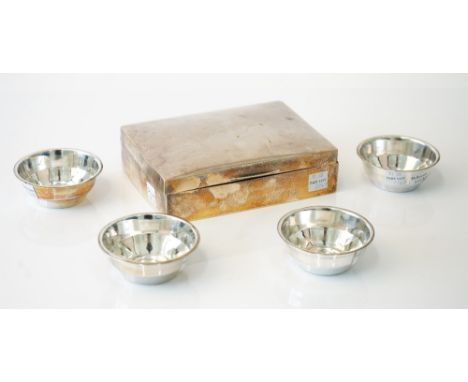 Silver and silver mounted wares, comprising; a rectangular playing cards' box, probably Birmingham 1922 and a set of four sma