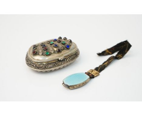 A European shaped oval hinge lidded snuff box, with scroll and partly fluted decoration, the hinged lid mounted with blue, gr