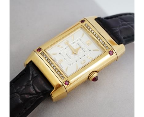 A Jaeger-Le Coultre Reverso 18ct gold, diamond and ruby set dress wristwatch, the signed silvered dial with gilt Arabic and b