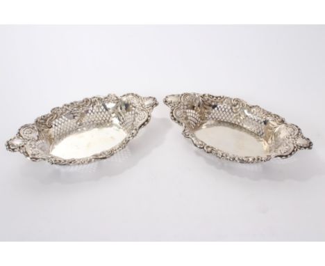Pair late Victorian silver baskets of oval form, with pierced rococo trellis work and scrolling foliate decoration (Birmingha