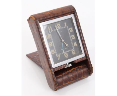 1930s Jaeger-LeCoultre travelling clock retailed by Asprey, with eight day movement in chrome plated rectangular case with bl