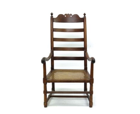 Rare 18th century American Colonial ladder back elbow chair with fret carved top rail and caned seat on turned and block unde