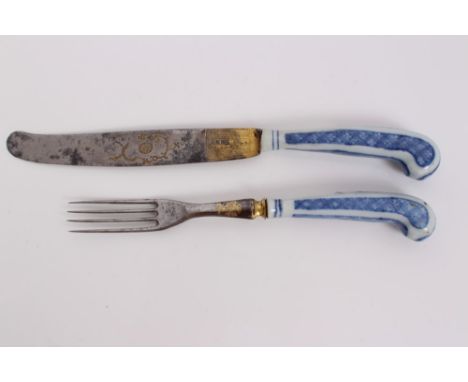 Pair 18th century Chinese export blue and white porcelain-handled knife and fork with pistol-shaped grips, French gilded and 