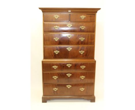 George III mahogany chest on chest with concave cornice and two short over six long graduated drawers, on bracket feet, 107cm