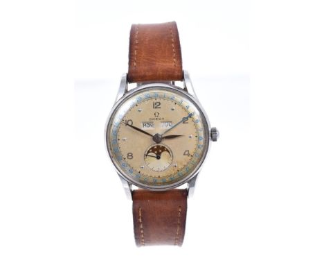 1950s gentlemen's Omega 'Cosmic' full calendar moonphase wristwatch, the circular dial with dot and Arabic hour markers, day 