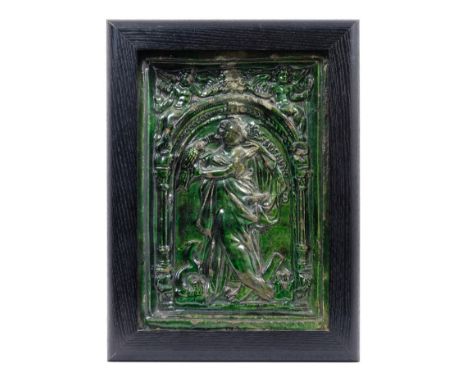 Rare mid-16th century German green glazed pottery stove tile decorated in relief with Lutheran religious female figure with a