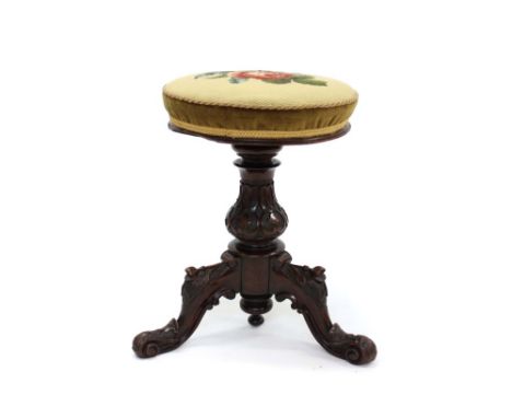 Victorian rosewood piano stool with circular floral tapestry seat rising on a thread, carved bulbous column on carved cabriol