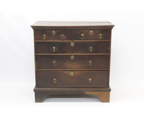 Early 18th century oak chest of drawers with two short over three graduated drawers, on bracket feet, 97cm wide x 53cm deep x