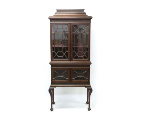 Early 20th century Chippendale revival mahogany display cabinet with blind-fret carved pagoda top and two astragal glazed tie