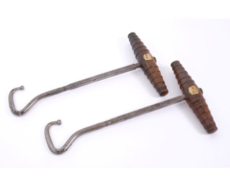 Pair of 19th century oak and steel 'London Bridge' boot-pulls of typical form, the turned handles with applied brass plaque e