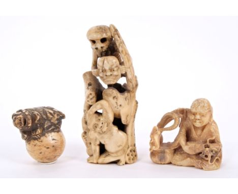 19th century Japanese carved bone netsuke of a lion on a ball, 4cm, Japanese carved bone ornament of a skeleton holding a the