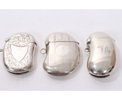 Edwardian silver vesta case of kidney form, with engraved monogram (Birmingham 1903), another early George V, with engraved d