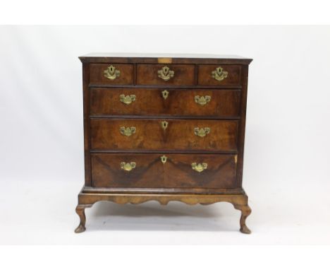 Early 18th century walnut crossbanded chest on later stand, with butterfly veneered crossbanded top and three short over thre