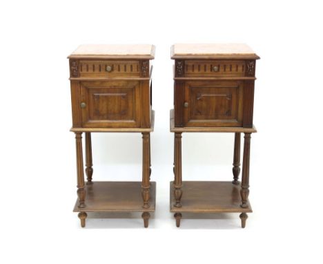 Pair of French walnut marble-topped bedside cupboards, each with square marble inset top and single drawer over fielded panel