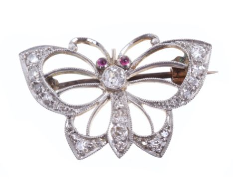 Edwardian novelty brooch in the form of a butterfly, the openwork design with cabochon ruby eyes and set with old cut diamond