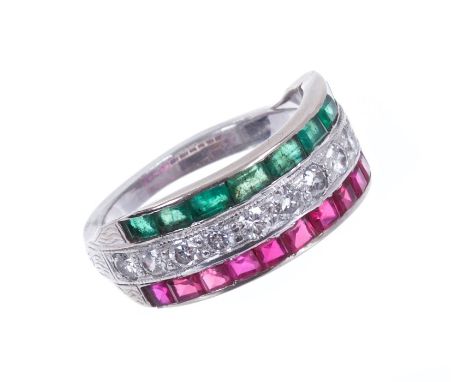 Art Deco diamond, emerald and ruby triple row ring, with a central band of twelve old cut diamonds flanked by a line of calib