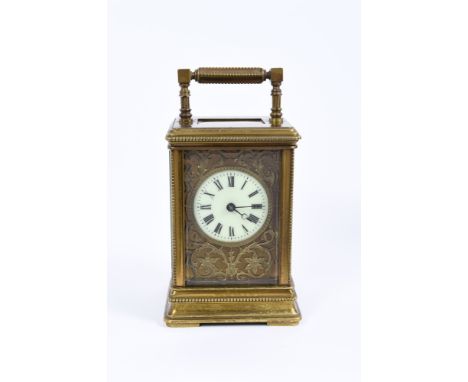 Late 19th century French carriage clock with circular enamel dial on gilt blind fretwork floral scroll ground, the gilt brass