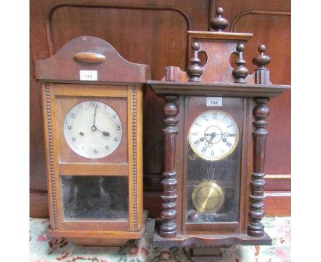 A Gustave Becker wall clock with an enamel dial and Roman Numerals together with an oak wall clock