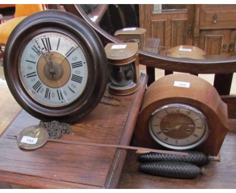 A Postman's wall clock with alarm dial striking on a bell, together with an oak mantle clock and a miniature copper stern lam