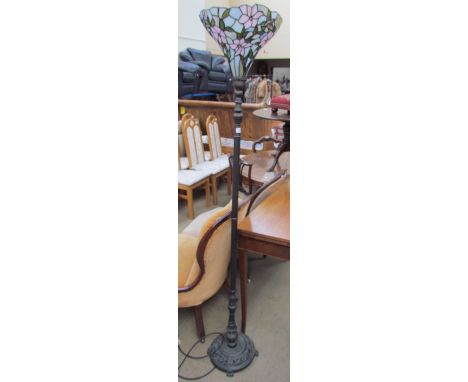 A Tiffany style standard lamp with a multicoloured glass shade