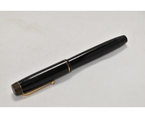 A button fill Valentine fountain pen in black with single narrow band to the cap