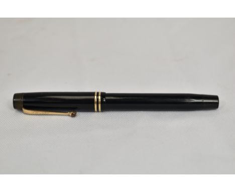 A Parker Duofold Streamlined button fill fountain pen in black with two bands to the cap and having Parker Duofold nib. In Ve