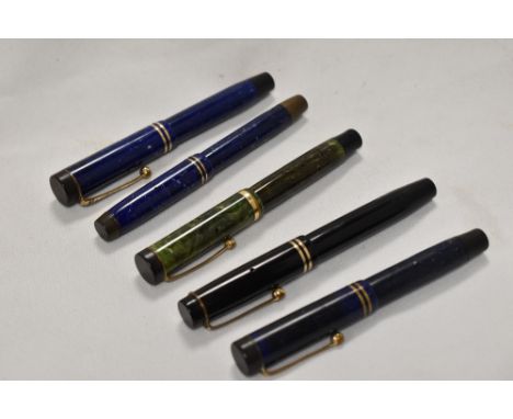 Five Parker Jr button fill fountain pens including Stremline and Lucky Curve in blue, lapis, jade green, and black all having