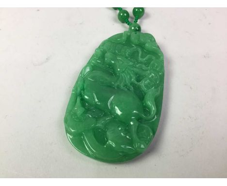 JADE NECKLET with large carved pendant of a horse, the knotted necklace formed with spherical beads