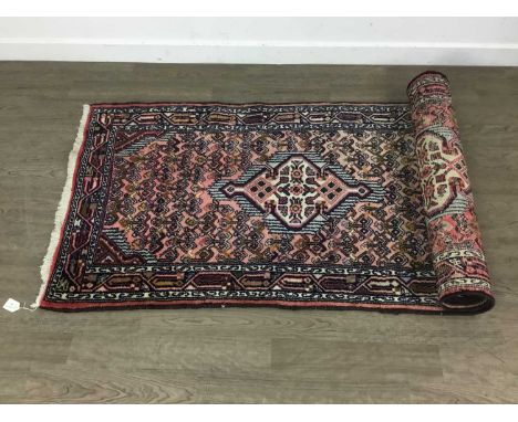 IRANIAN FLOOR RUNNER, AND A MODERN EXAMPLE the Iranian runner with central medallions Iranian runner 306cm long, 82cm wideQty