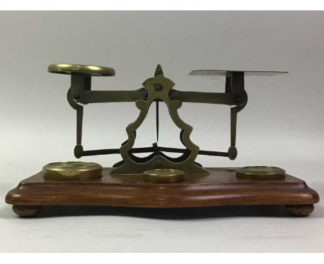 SET OF POSTAL SCALES, EARLY 20TH CENTURY along with a set of four copper measures, George III style mahogany kidney shaped se