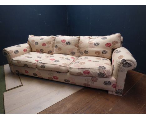 Large contemporary 3 seater sofa upholstered in cream fabric with modern floral pattern 94H x 250W cm