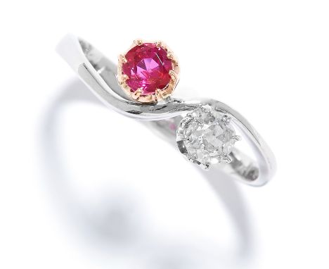 RUBY AND DIAMOND TOI ET MOI RING set with a round cut ruby and diamond, size P / 7.5, 3.0g.