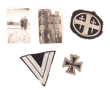 A collection of original WWII Second World War items relating to a German soldier, comprising; his Iron Cross (2nd Class), hi
