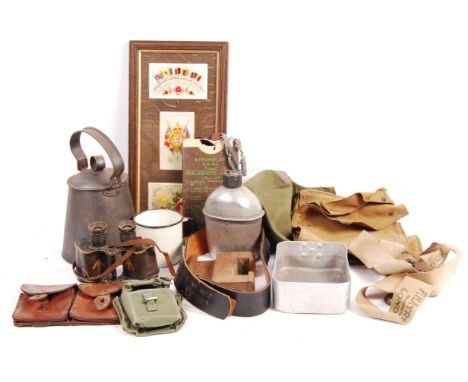 A collection of assorted WWI First and WWII Second World War militaria, to include; a framed collection of WWI silk postcards