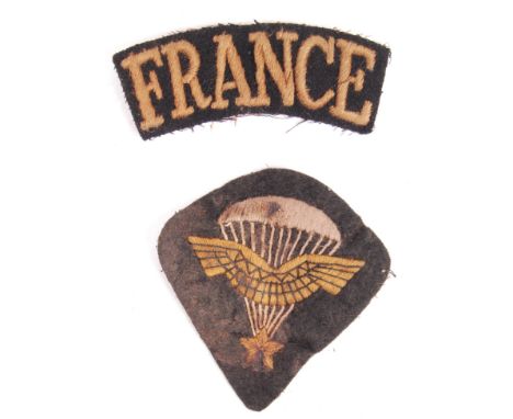 A collection of x3 original WWII Second World War uniform patches, comprising; a ' Free French Forces ' cloth shoulder patch,