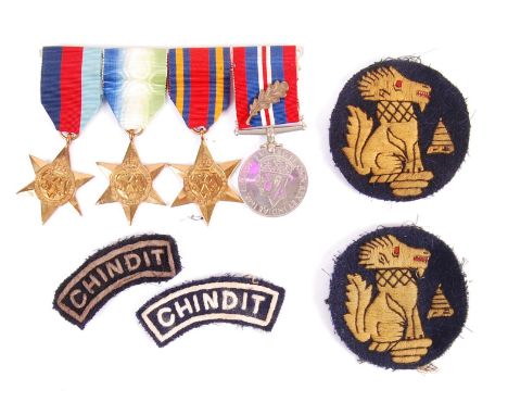 A WWII Second World War medal group and cloth patch collection relating to a member of The Chindits / LRPG Long Range Penetra