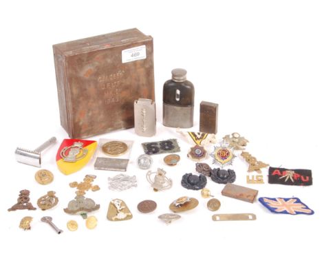 An assorted collection of assorted WWII Second World War (and later) buttons, badges and cloth patches. All housed within an 