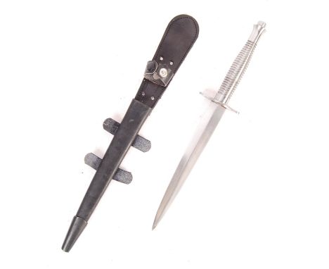 A WWII Second World War replica Fairbairn Sykes 2nd pattern F-S all steel fighting knife and scabbard, having the beveled poi