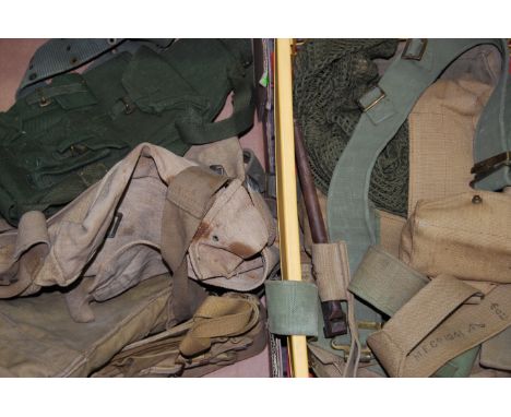 A large collection of assorted WWII Second World War and post-WWII British Army webbing and uniform items. Includes; gaiters,