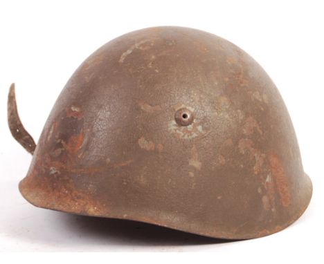 A rare WWII Second World War Italian Army steel combat helmet - complete with inner leather liner and partial chin strap. Ori