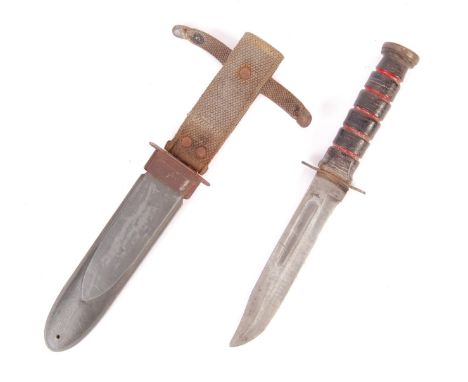 A WWII Second World War American USN MK2 Combat Knife, single edged clipped point blade, the scabbard stamped “U.S.N MARK 2” 