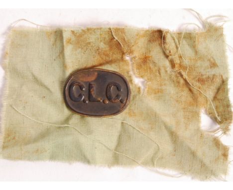 A rare original WWI First World War ' CLC '&nbsp; (Chinese Labour Corps) tin uniform badge. Simple tin construction in oval f