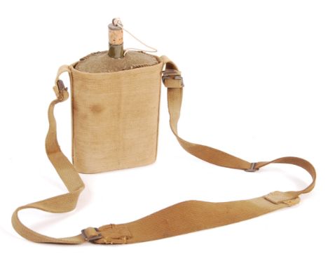 An original WWII Second World War British issue water bottle canteen and holder. Named to the inside of the pocket to a ' Lie