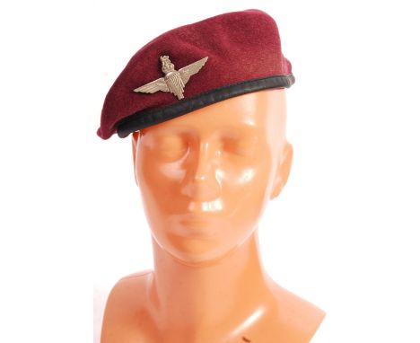 An original WWII Second World War British Army Paratrooper uniform beret. Red, with black band. Retains an original Paratroop