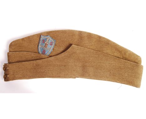 An incredibly rare original WWII Second World War British ' SBS ' Special Boat Service uniform forage / side cap. Stamp to in