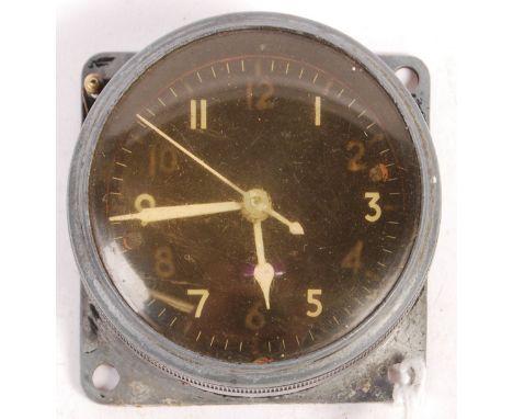 An original WWII Second World War aircraft cockpit clock MkII 6A/1002. Metal alloy case with black circular dial and luminous