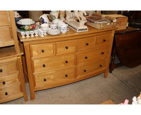 A light oak modern chest fitted six drawers