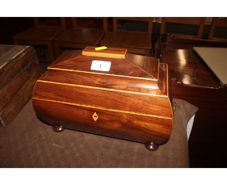 A 19th Century rosewood and boxwood strung tea caddy flanked by ring handles raised on bun feet for restoration 