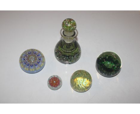 A Caithness "Sea Crab" limited edition paperweight; a Millefiori paperweight; two others and a scent bottle 